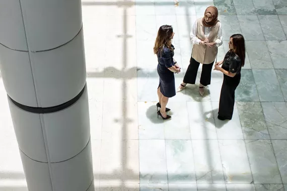 Three women standing together